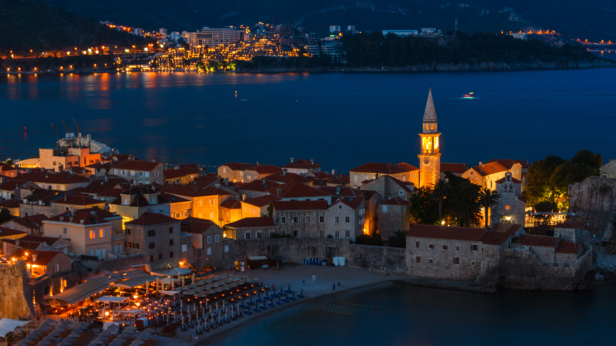 View of old town Budva at sunset, blue hours and night.  Montenegro. Adriatic sea.