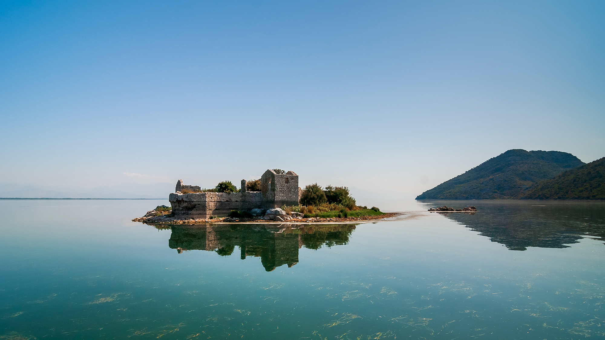 Montenegro landscape. In the center of Skadar Lake are the ruins of a fortress - Grmozur Prison. The ruins are about two hundred years old.