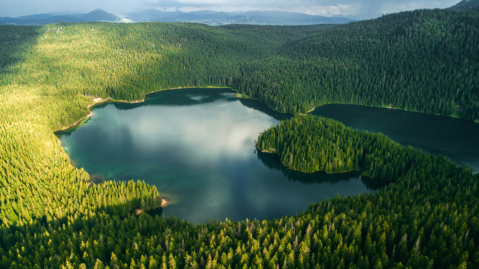 Aerial view at a beautiful lake in the mountains. Black Lake, Montenegro.